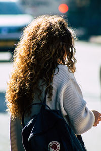 Rear view of woman with umbrella