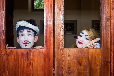 Portrait of man and woman wearing stage make-up