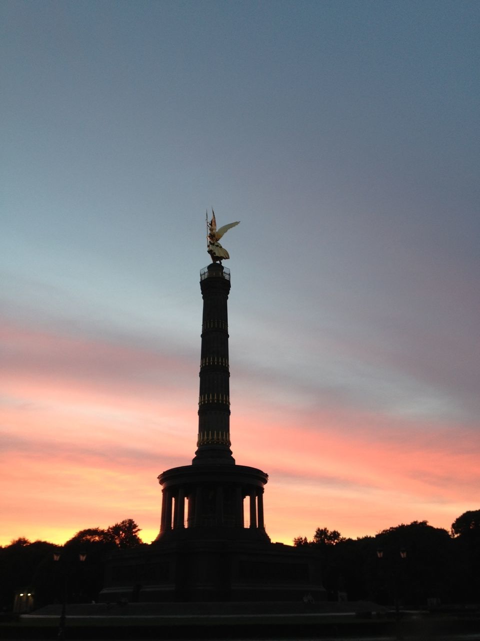 statue, human representation, sculpture, art and craft, art, creativity, famous place, sunset, sky, travel destinations, international landmark, tourism, travel, monument, low angle view, history, religion, silhouette