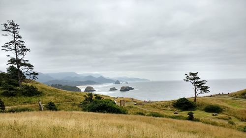 Scenic view of sea against cloudy sky