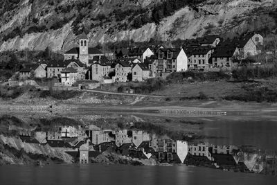 Scenic view of lake by houses in town