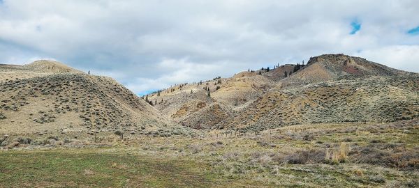 Panoramic view of rocky mountains against sky