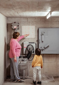 Rear view of man working at home