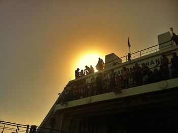 Low angle view of built structure at sunset