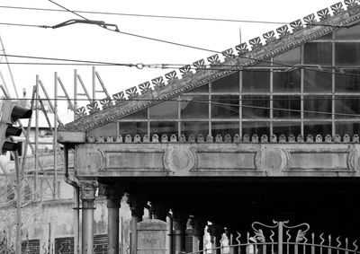 Low angle view of railway bridge against sky