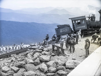 Panoramic view of people on mountain range