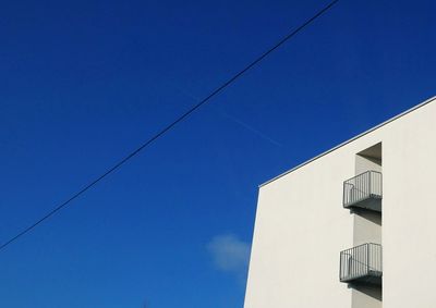 Low angle view of building against blue sky