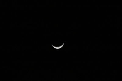 Low angle view of moon against sky at night