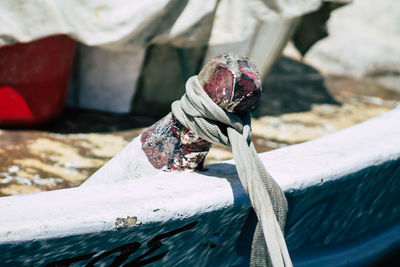 Close-up of rope tied to bollard in winter