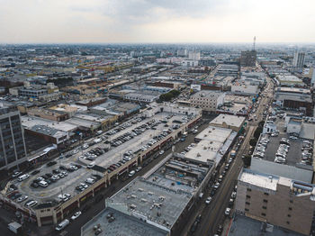 High angle view of buildings in city against sky