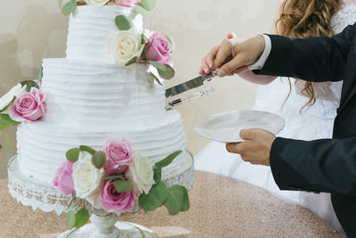 Midsection of woman holding flower bouquet