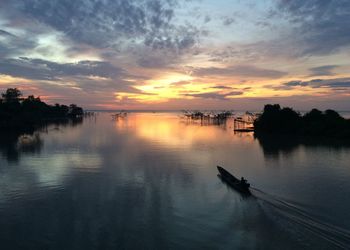 Scenic view of lake against sky during sunset