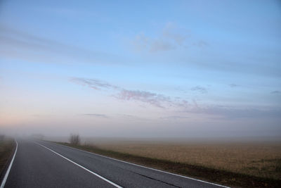 Empty road against sky