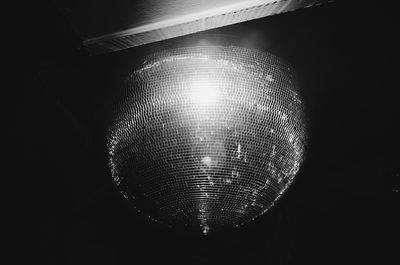 Low angle view of illuminated lighting equipment