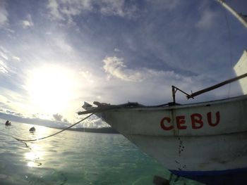 Information sign on sea against sky