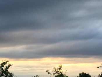 Low angle view of cloudy sky during sunset