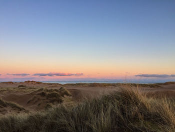 Scenic view of landscape at sunset