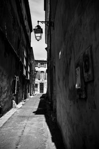 Narrow alley amidst buildings in city