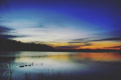 Scenic view of lake at sunset