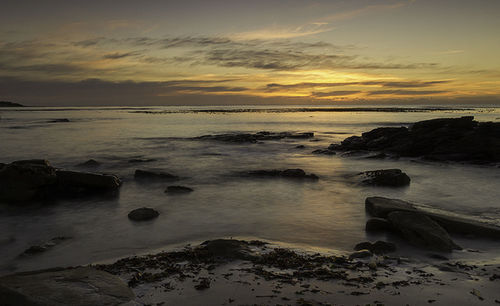 Scenic view of sea at sunset