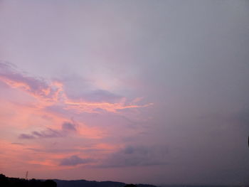 Low angle view of dramatic sky during sunset