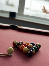 Close-up of multi colored balls on table. pool