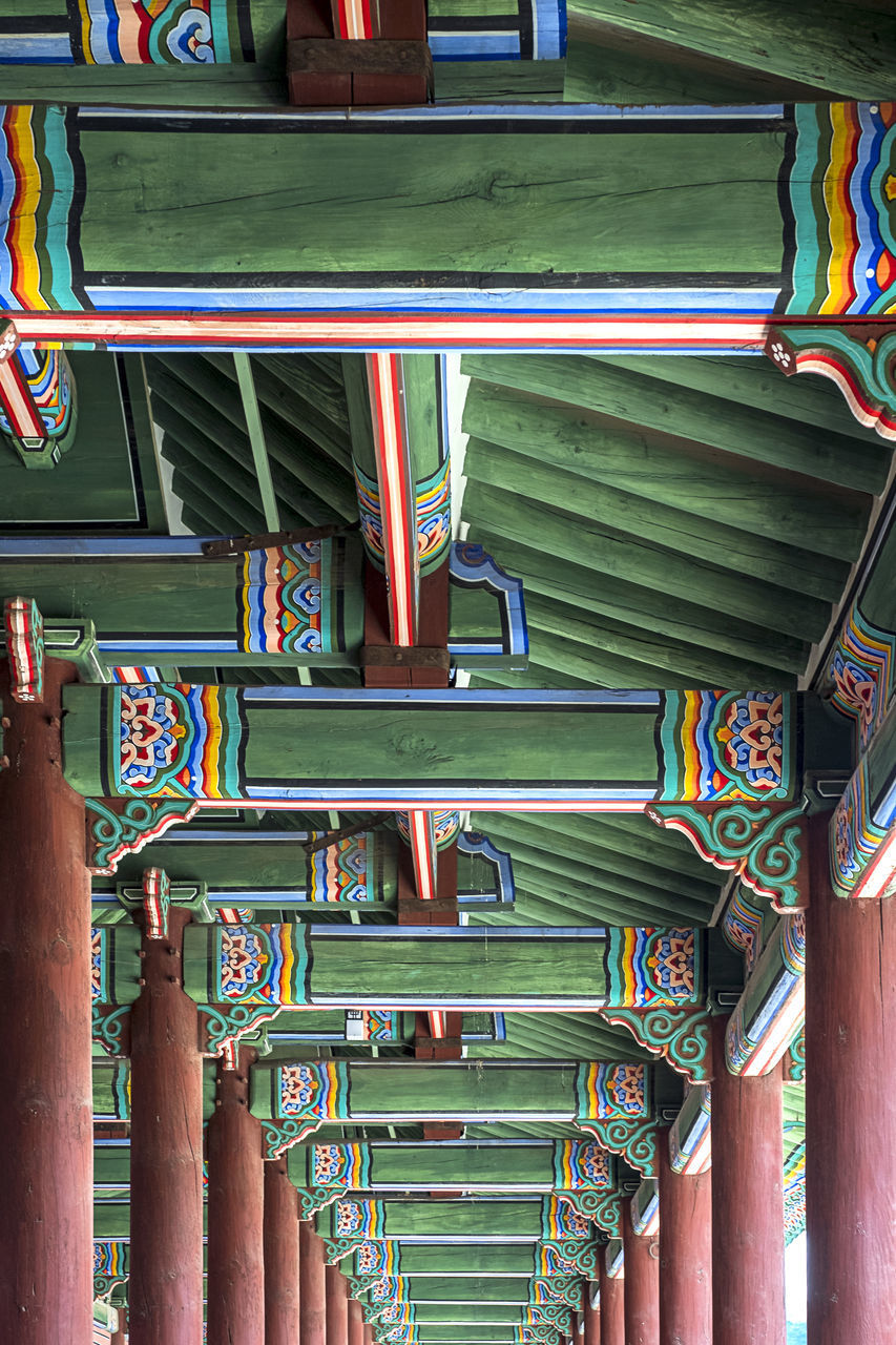 LOW ANGLE VIEW OF MULTI COLORED BUILDING INTERIOR