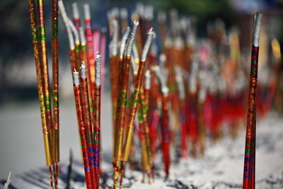 Extinguished incense sticks and ashes-red golden glossy paper-dafo si great buddha temple-china-1282