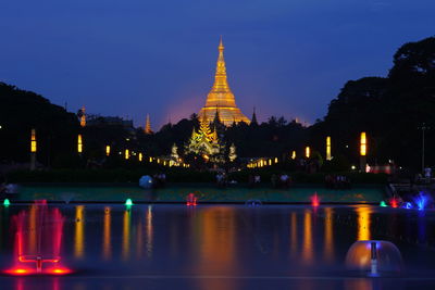 View of illuminated temple against sky at night