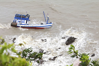 High angle view of ship sailing in sea