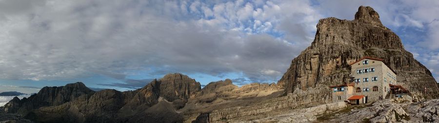 Scenic view of mountains against cloudy sky