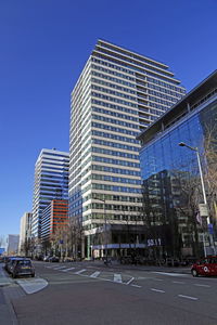 View of city street and buildings against sky