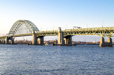 Bridge over river against clear sky