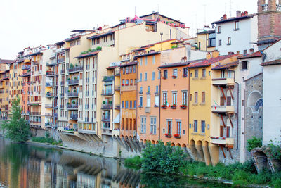 Residential buildings in city against clear sky