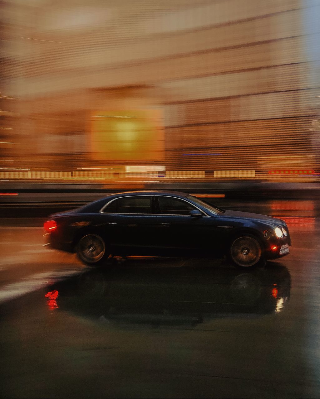 transportation, car, mode of transportation, motion, motor vehicle, blurred motion, speed, on the move, illuminated, land vehicle, city, no people, road, street, travel, architecture, night, long exposure, red, sunset