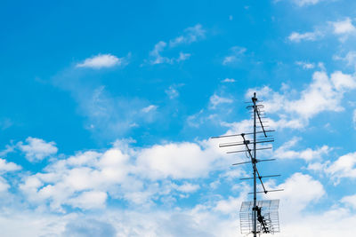 Low angle view of communications tower against sky