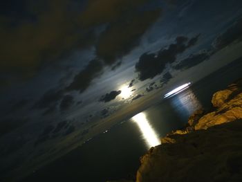 Scenic view of sea against sky at night