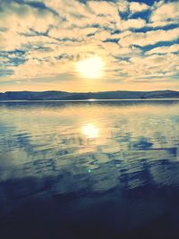 Scenic view of sea against romantic sky at sunset