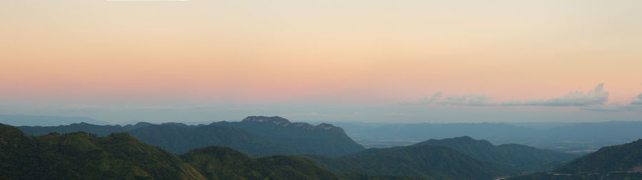 Scenic view of mountains against sky during sunset