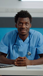 Portrait of doctor holding stethoscope