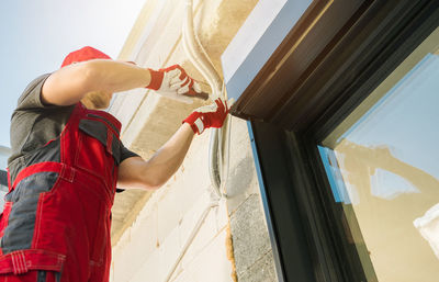 Rear view of woman using mobile phone