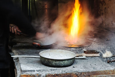 Close-up of man preparing food