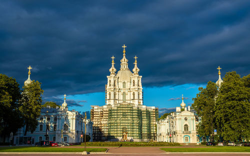 Buildings against cloudy sky