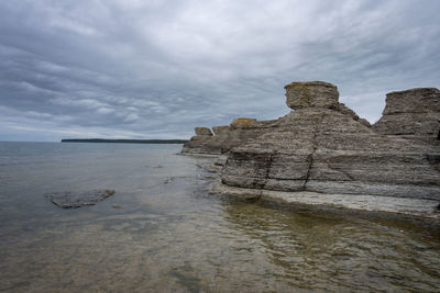 Limestone formation at a coast line with a dramatic sky in the background