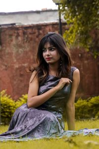  young woman sitting in garden