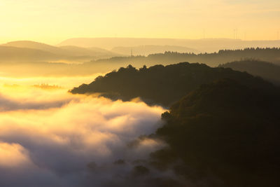 Scenic view of mountains against sky during sunset