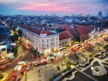 High angle view of city street and buildings against sky