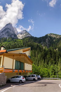 Cars on road against mountain range