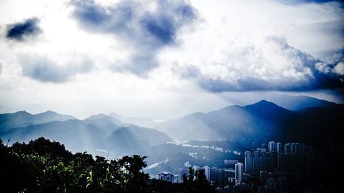 Scenic view of mountains against cloudy sky