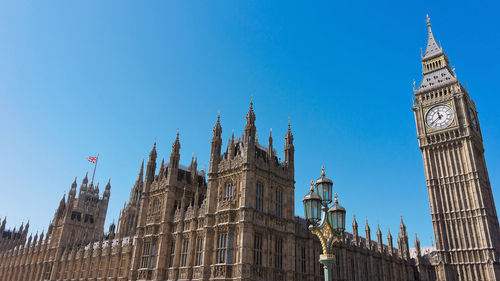 Low angle view of buildings against blue sky